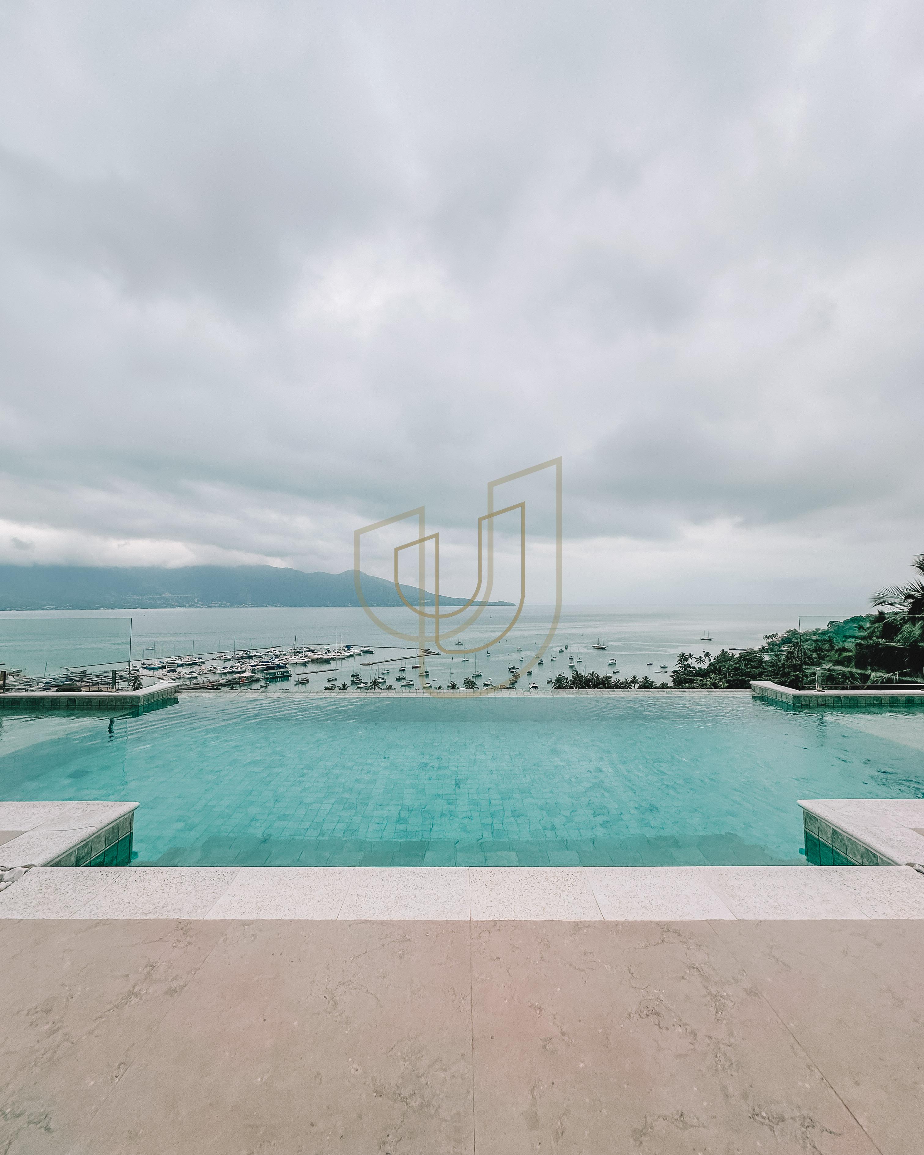 Mans&atilde;o de luxo com arquitetura em meio as rochas com 7 su&iacute;tes em Centro - Ilhabela/SP  Ilhabela - 