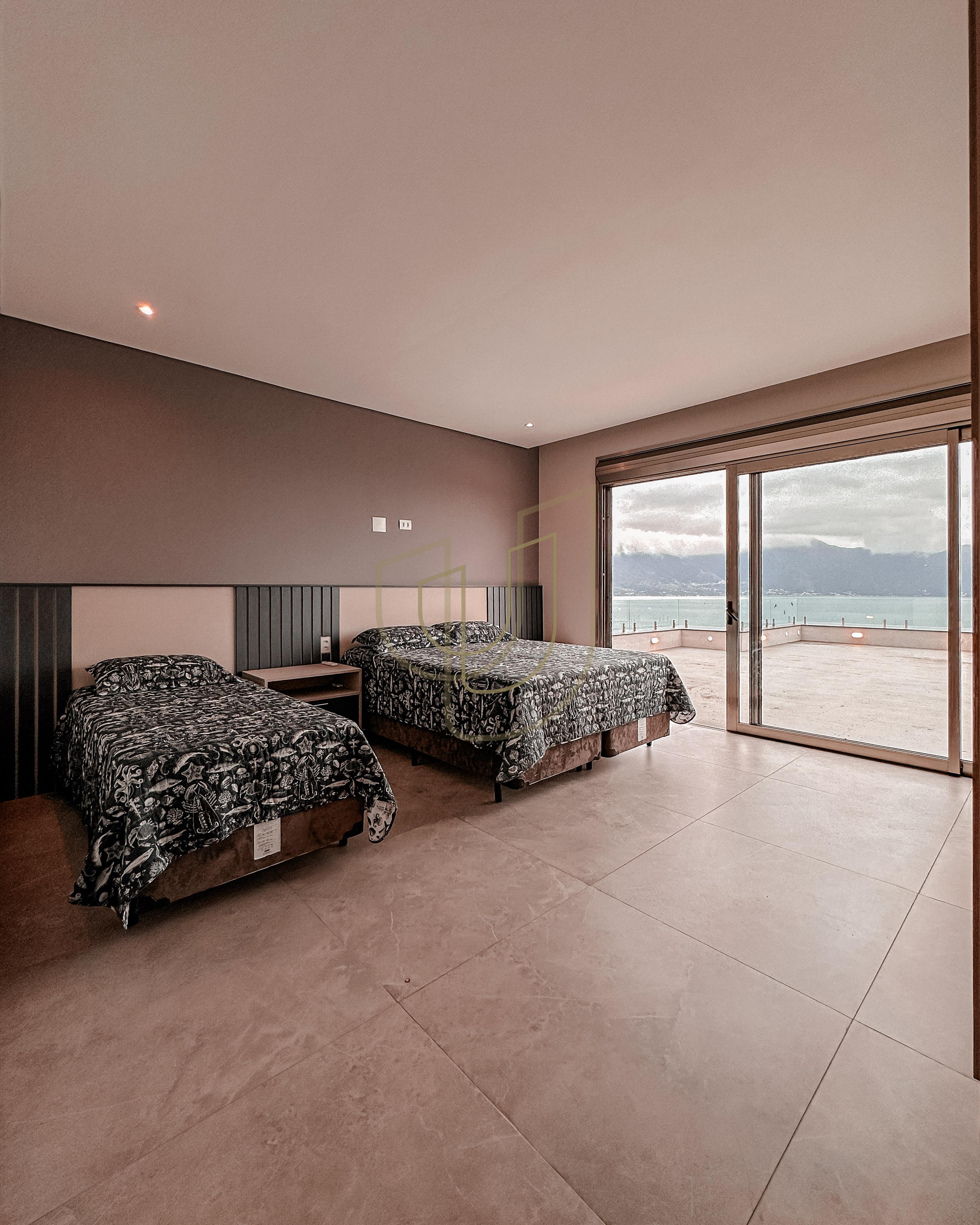 Mans&atilde;o de luxo com arquitetura em meio as rochas com 7 su&iacute;tes em Centro - Ilhabela/SP  Ilhabela - 