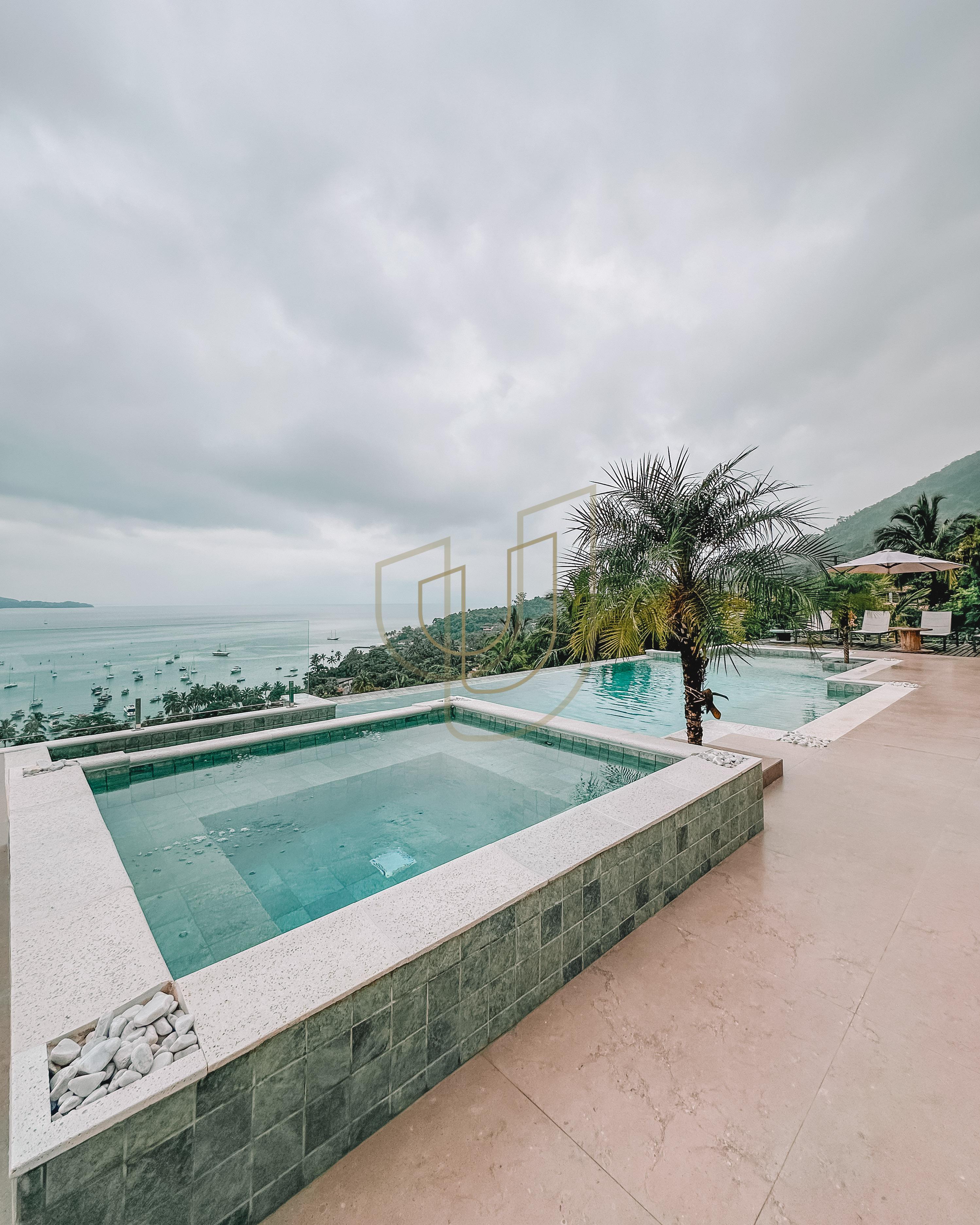 Mans&atilde;o de luxo com arquitetura em meio as rochas com 7 su&iacute;tes em Centro - Ilhabela/SP  Ilhabela - 