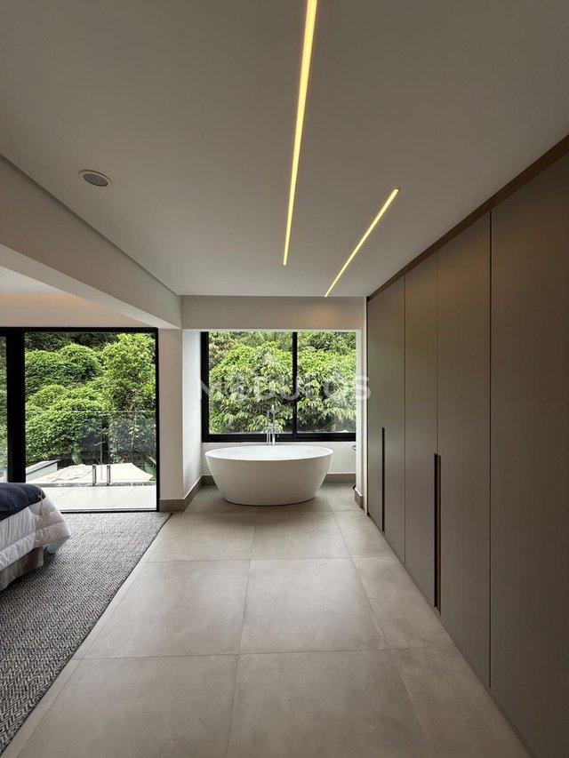 Propriedade minimalista com 5 suítes à venda, 409 m² por R$ 8.500.000,00 Alameda Baguio Bertioga - 